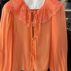 Aritzia silk orange see through tie front blouse.